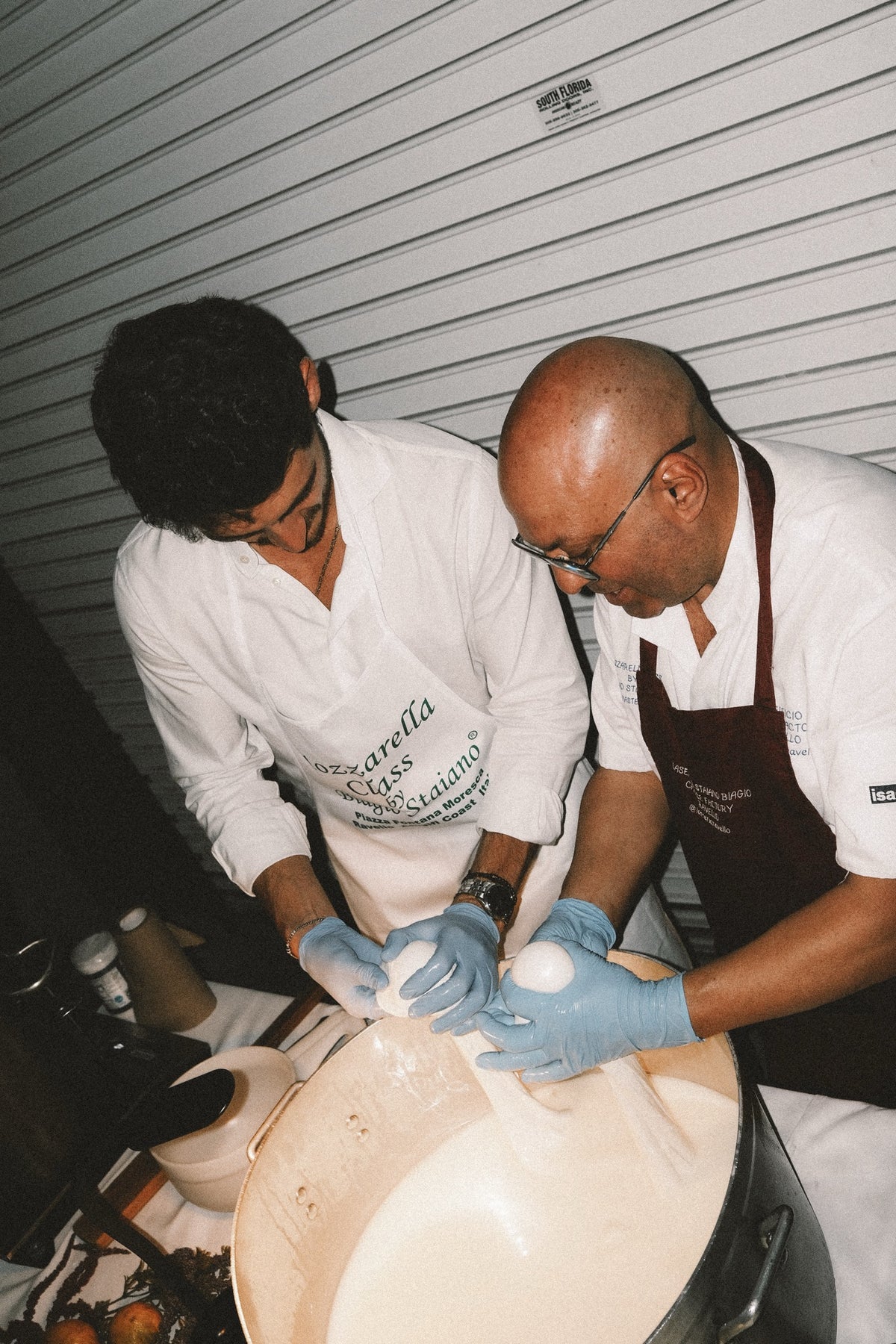 Hands working the curd