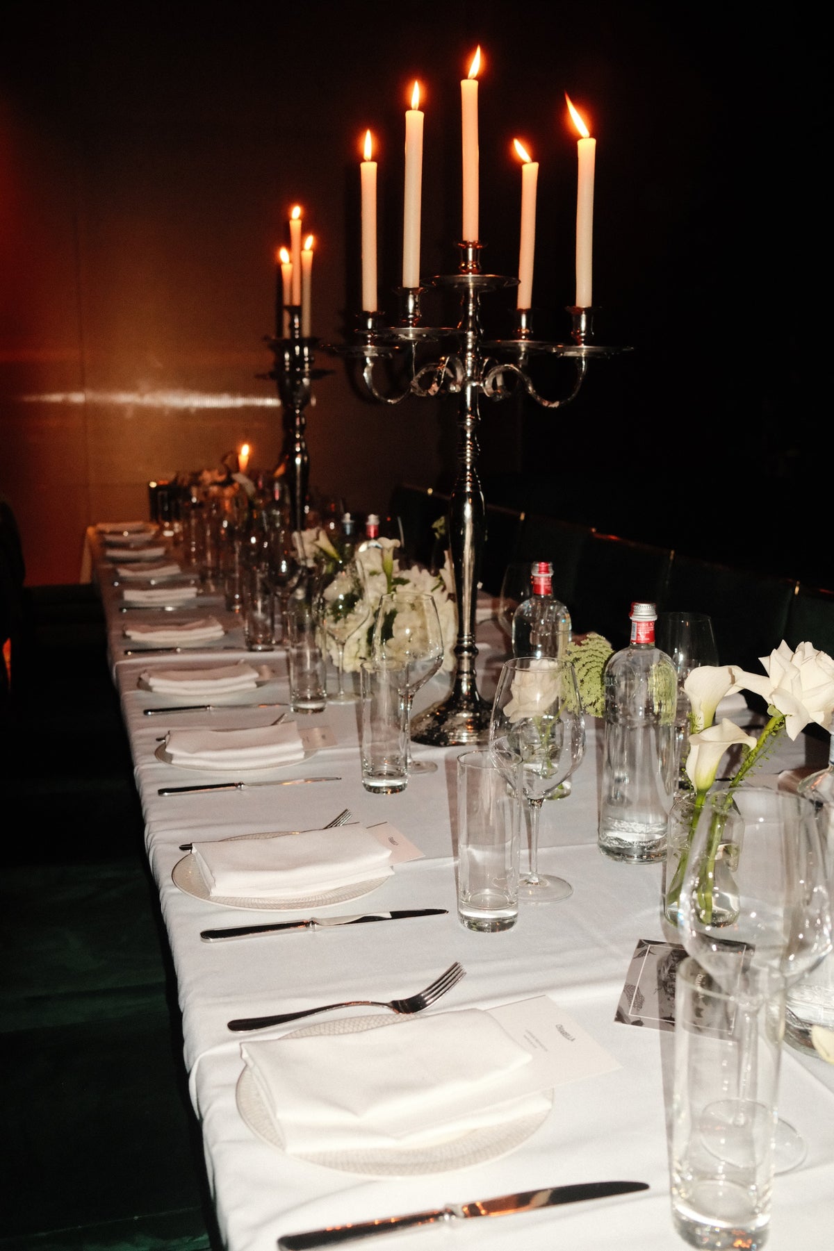 A candlelit dinner table at Maple & Ash, Miami